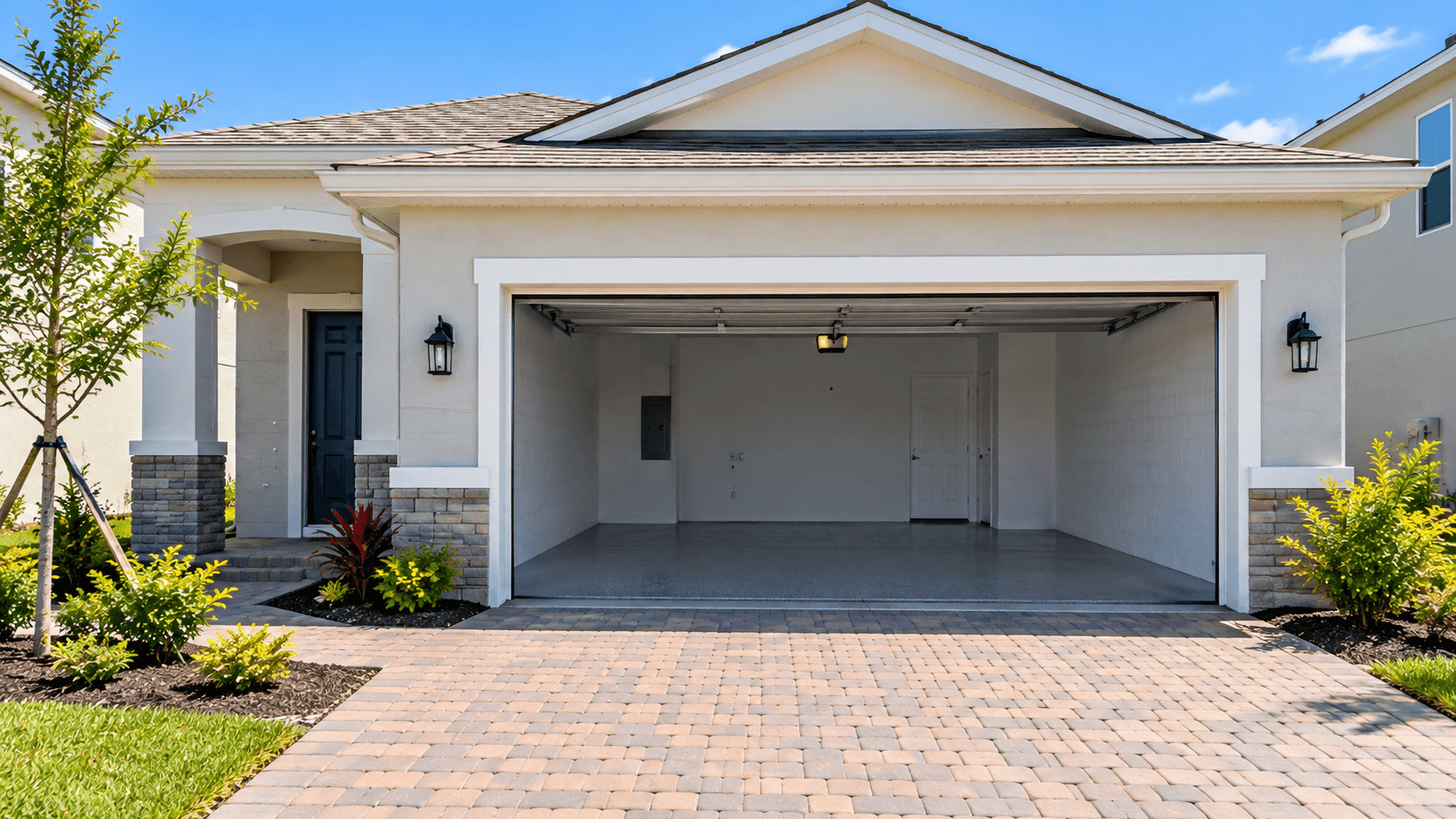 Open two-car garage at a single-family home in Juniper Cove, Homestead