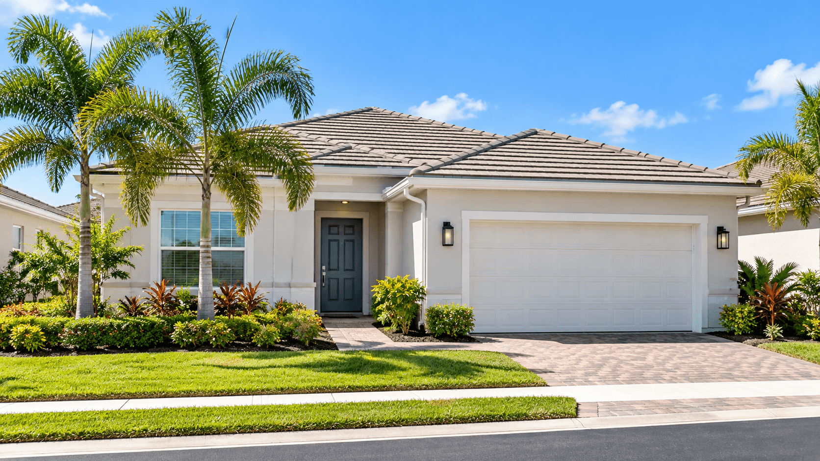 Front of a one-story villa at Delray Trails with the front door and one-car garage