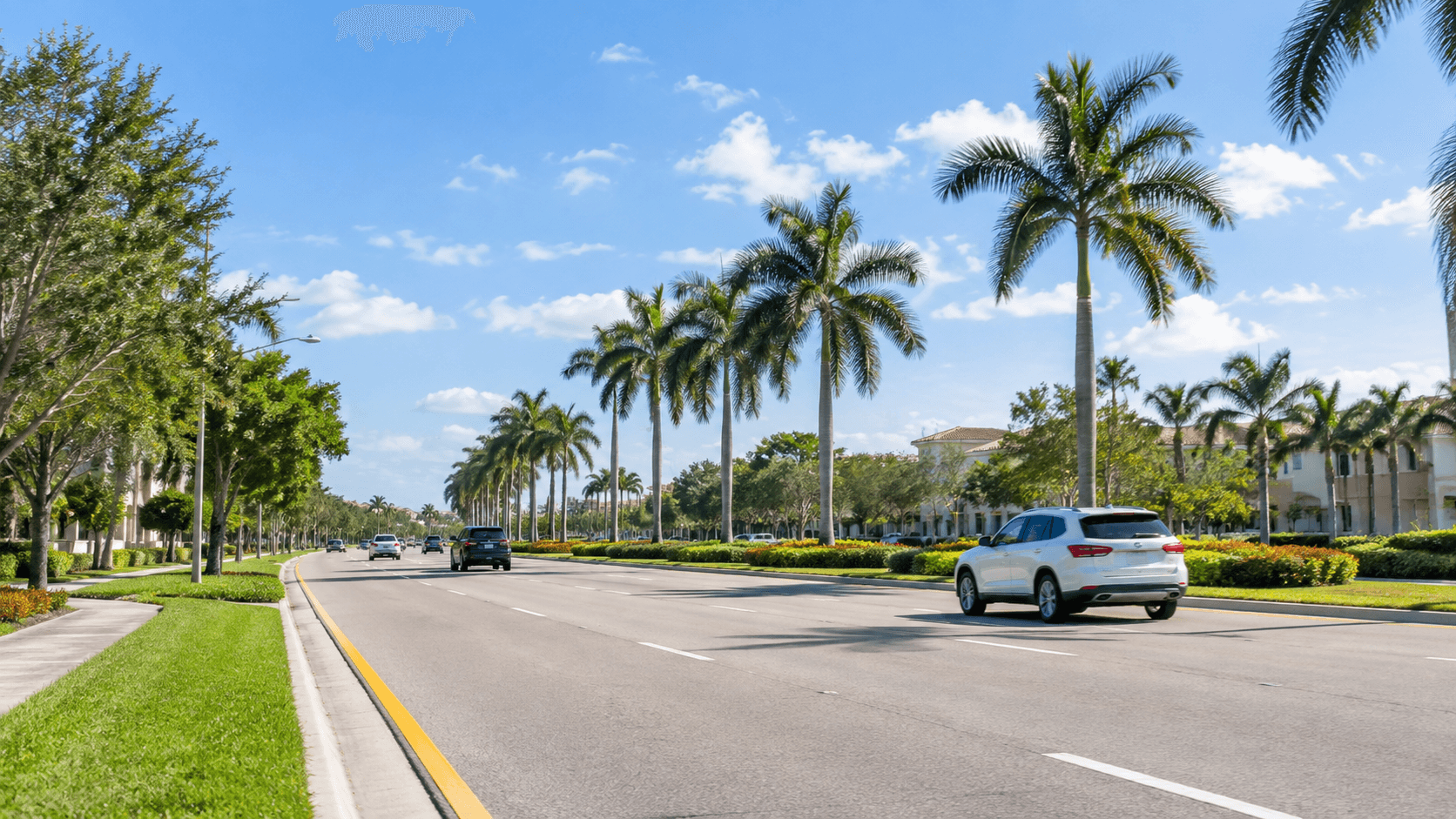 Main boulevard with palm trees in Palm Beach Gardens, Florida