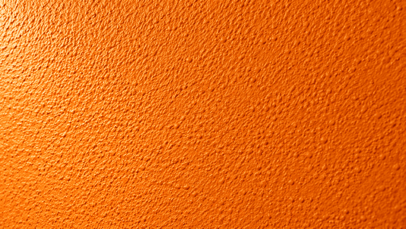 Close-up of orange peel texture on a painted wall