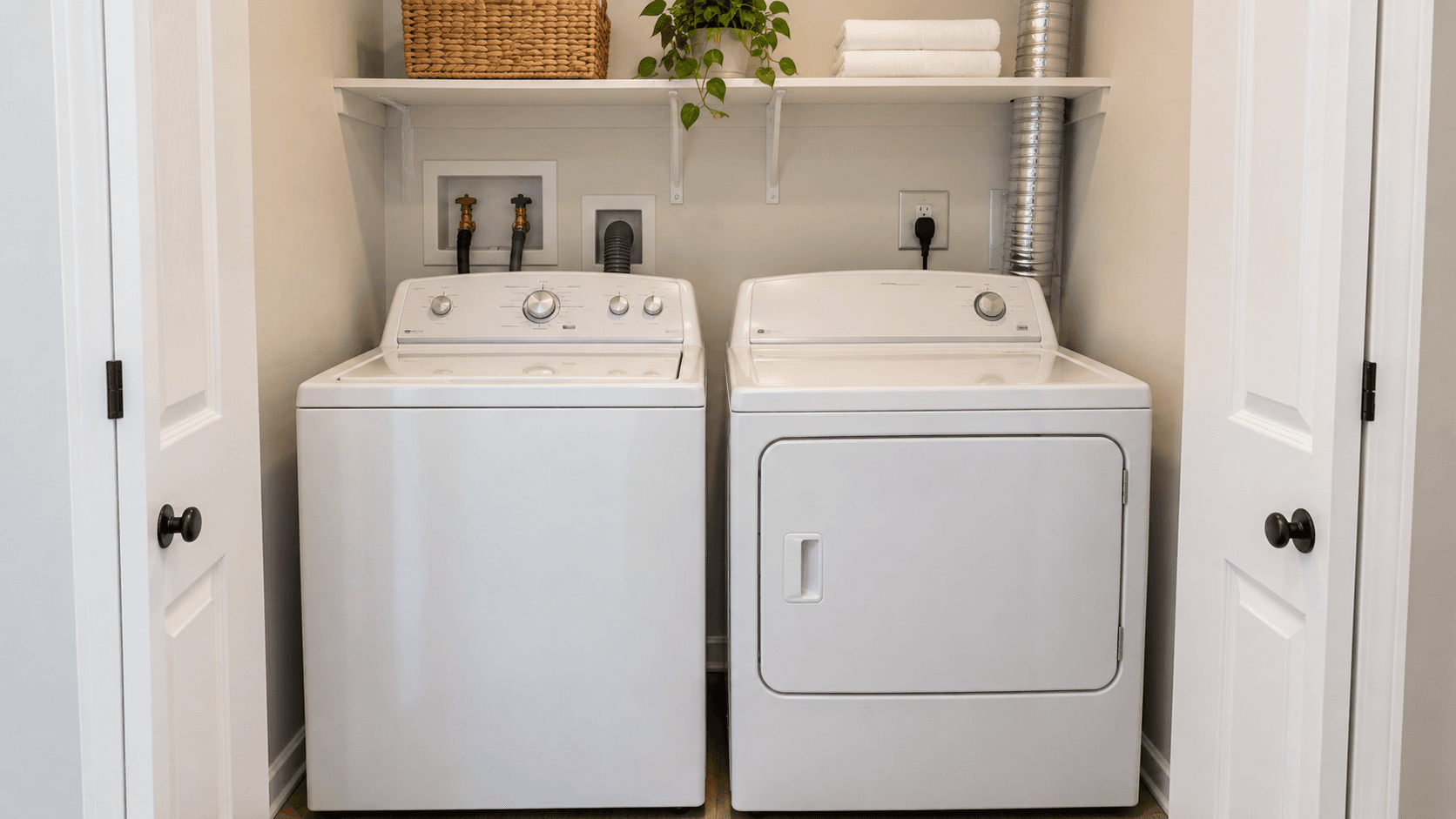 Washer and dryer side by side in a laundry closet