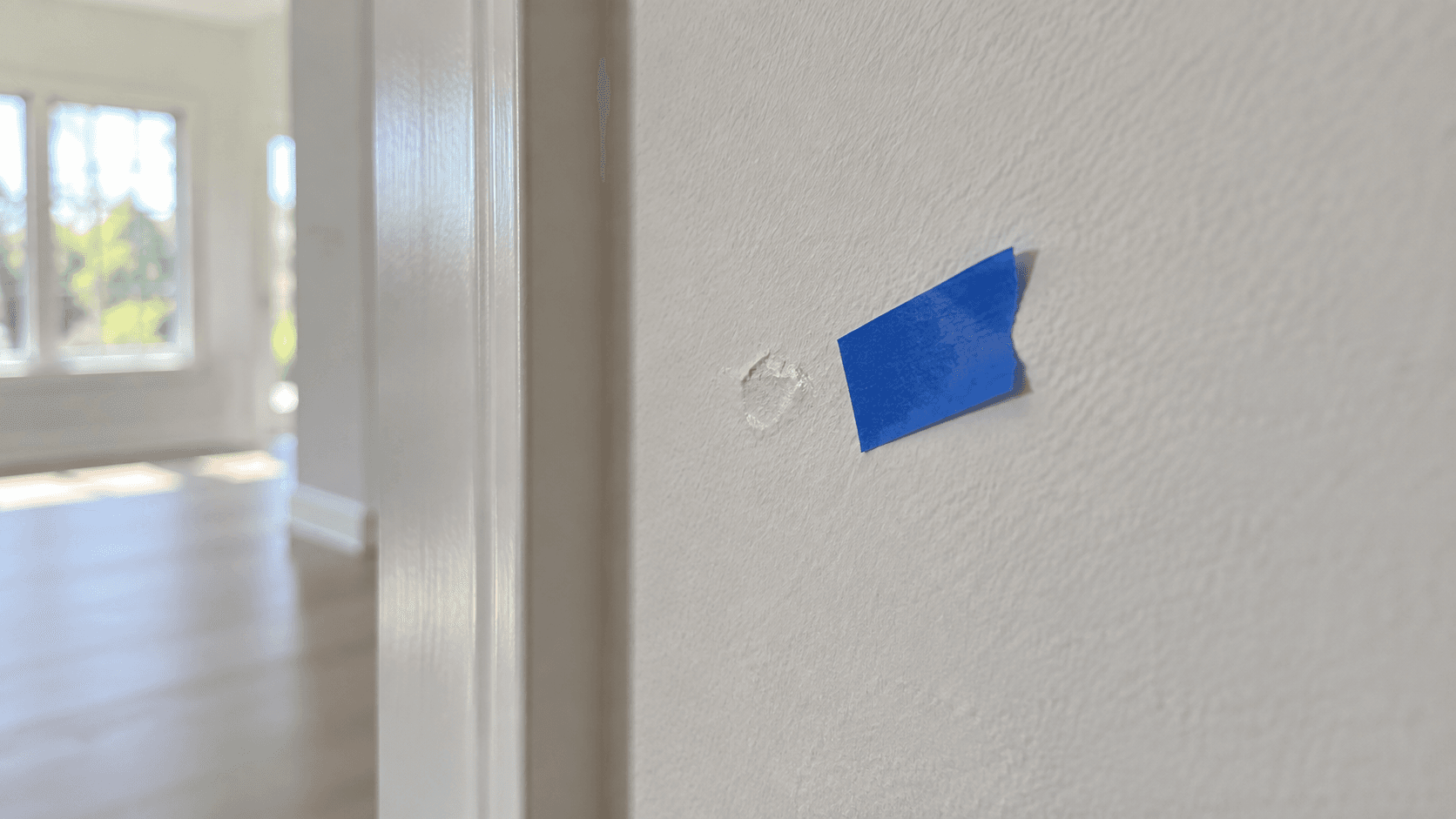 Blue painter's tape marking a new-home finish item